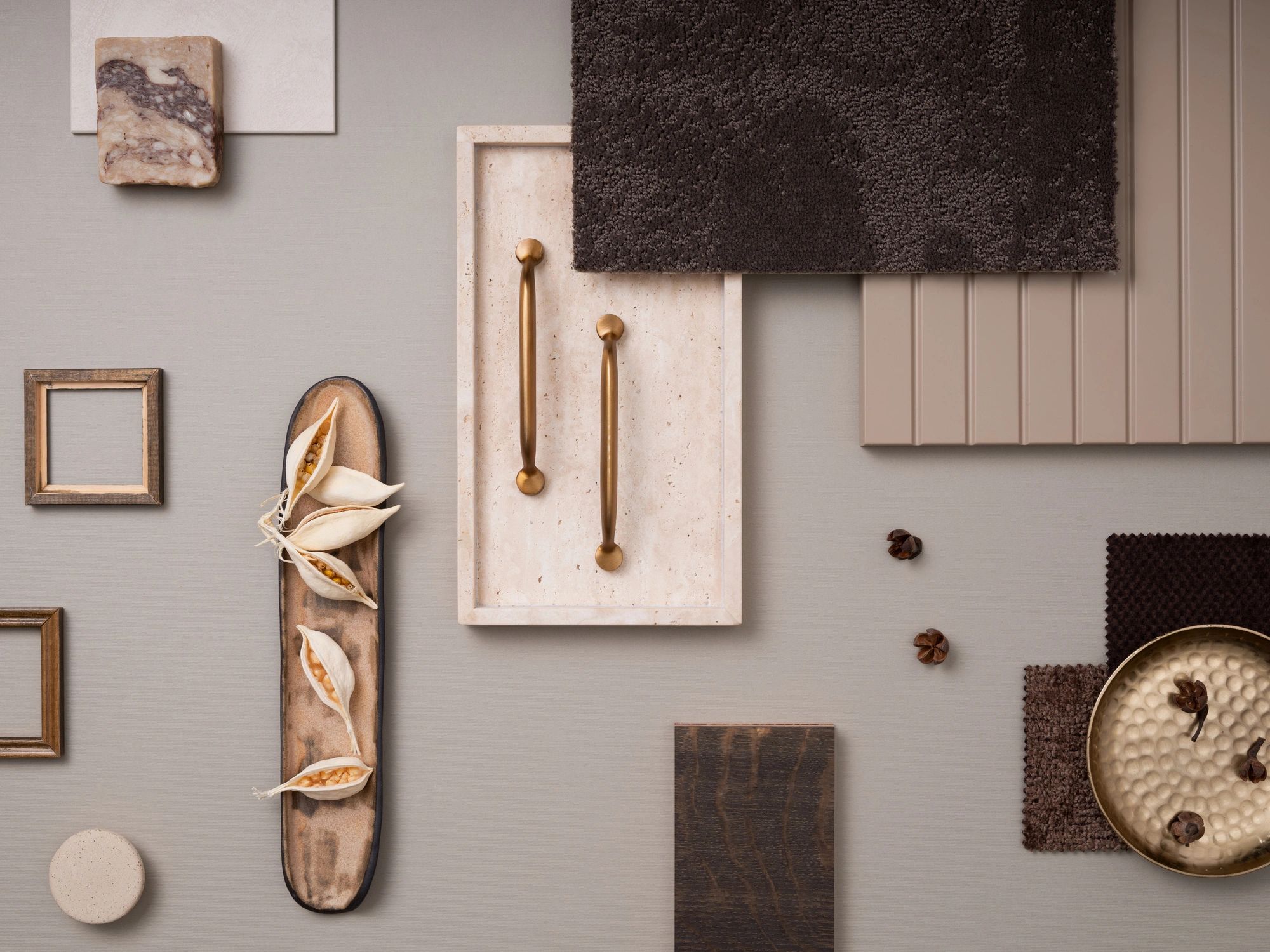 Neutral-toned flat lay of curated materials and samples